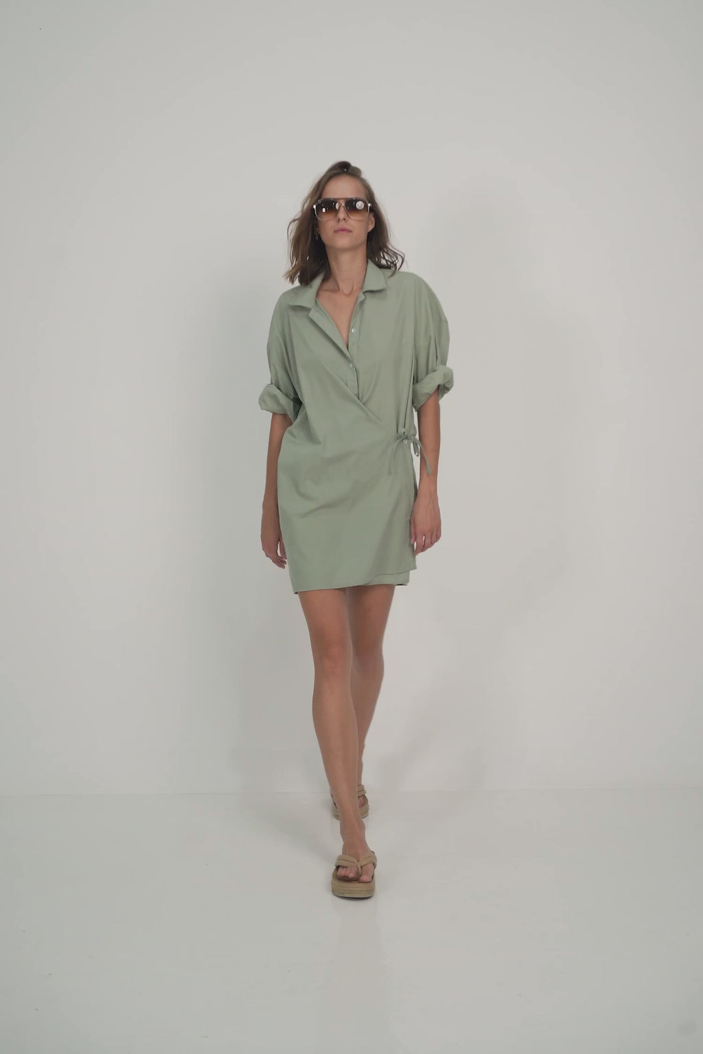 A Model Wears a Casual Green Cotton Mini Dress for Summer