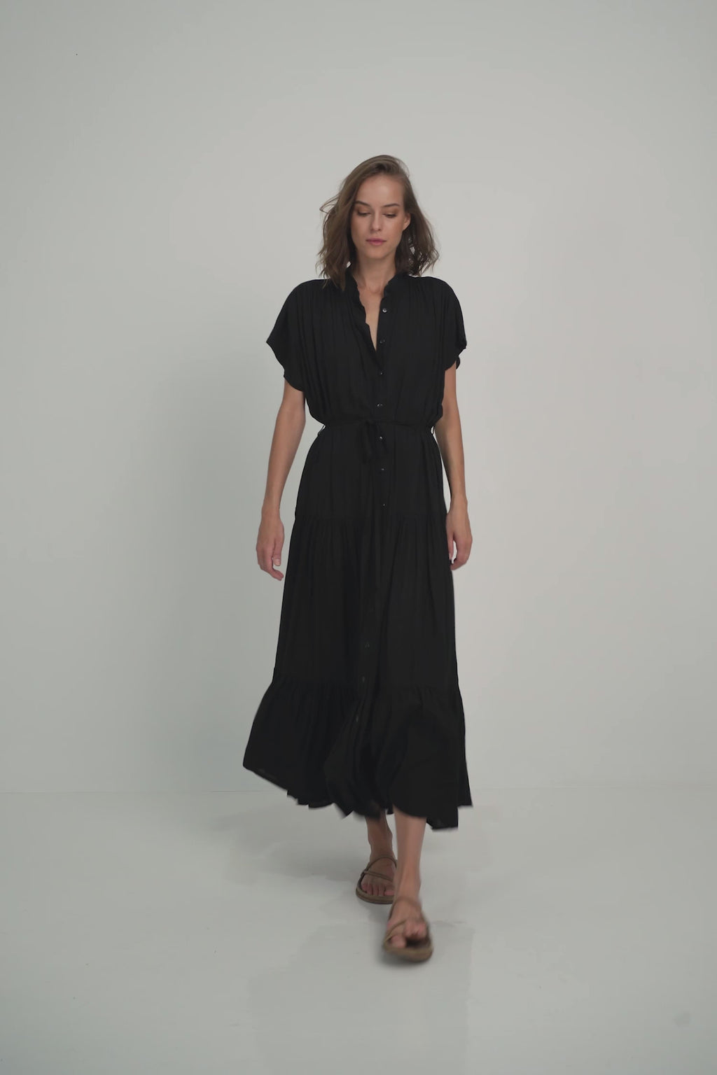 A Woman Wearing a Classic Black Maxi Shirt Dress for Summer