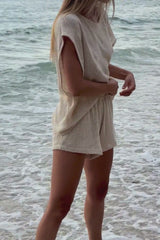 Women’s cotton mesh shorts styled with a simple tank on the beach 