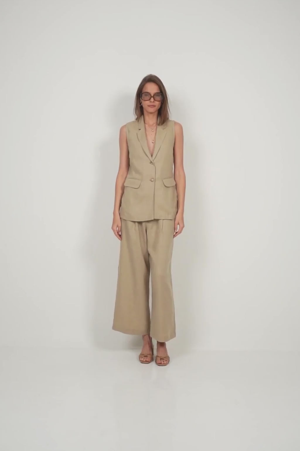 LILYA Malachite Vest styled with matching pants in sand
