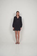 Feminine lace mini dress styled for casual summer days