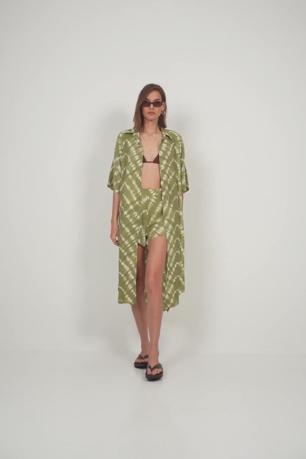 Elbow-length sleeve detail on relaxed shirt dress