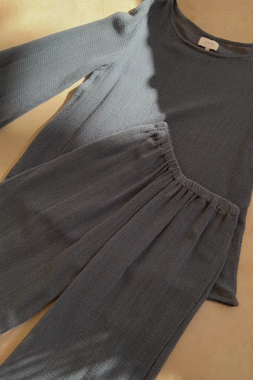 Video showing the detail of the Allegra mesh top and the matching elastic waist pants. 