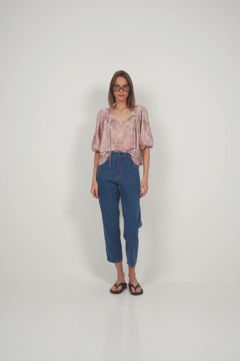Back view of floral puff sleeve blouse by LILYA, spring fashion look