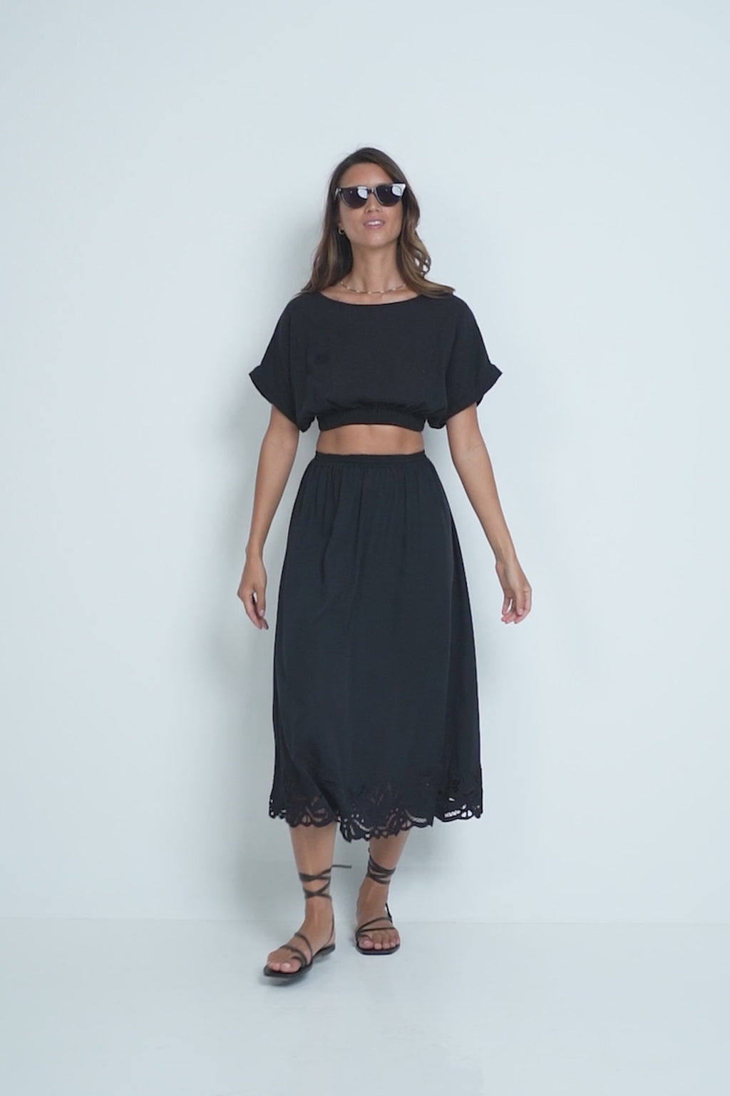 A Model Wearing the Loren Skirt Black by LILYA