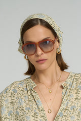 Close up of a floral head scarf Lilya