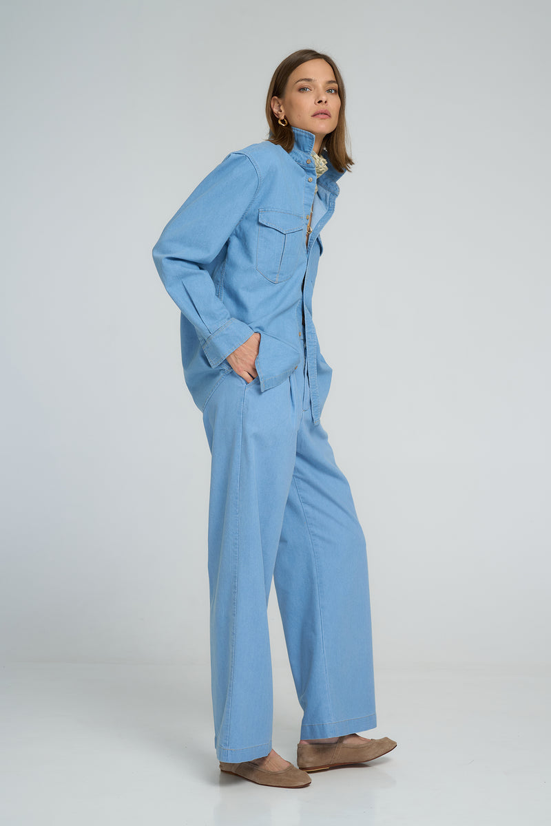 Soft washed chambray button-down shirt styled with relaxed pants for effortless style