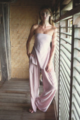 Airy striped top styled with relaxed shorts and flat sandals