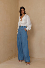 Wide-leg chambray pants styled casually with white blouse