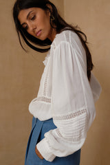 Relaxed white blouse for women over 40 and 50
