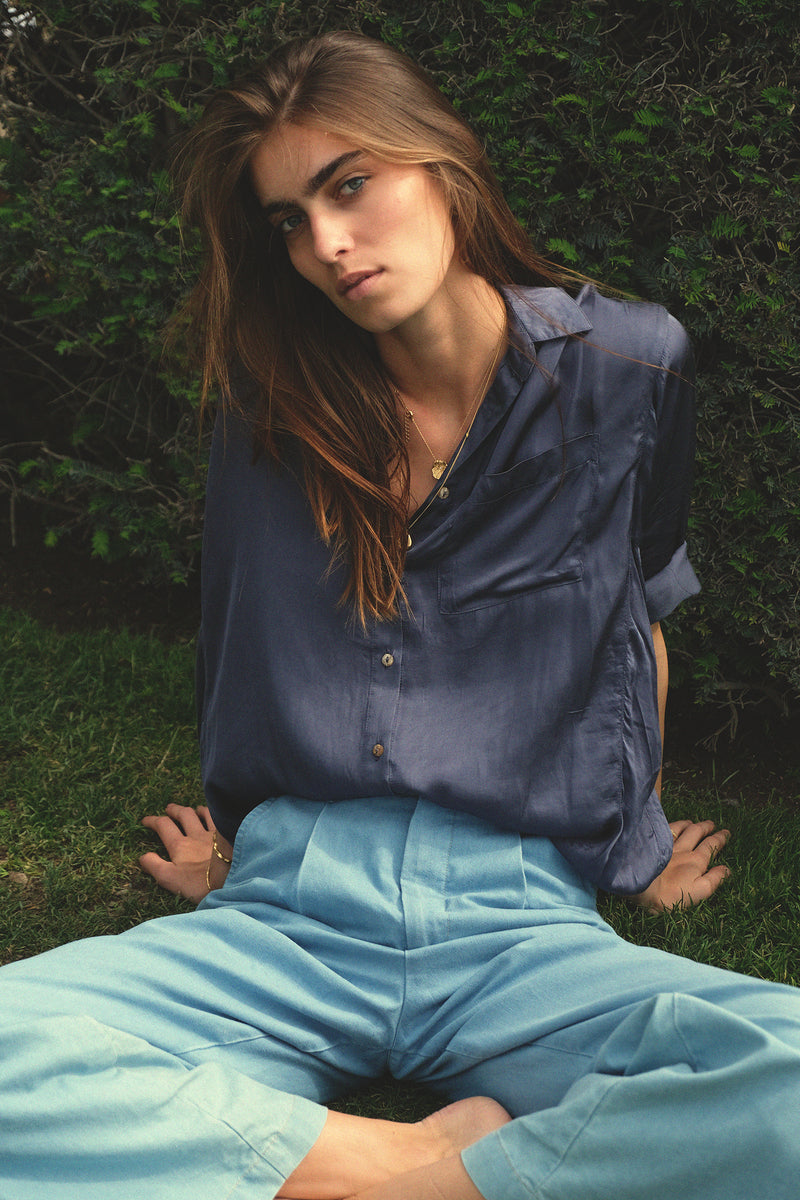 Close up of navy long sleeve soft blouse