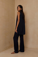 High waisted navy pants styled for day to evening dressing 