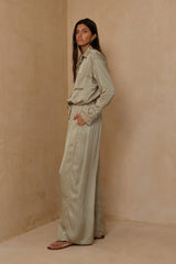 Wide-leg satin pants styled for effortless day-to-evening dressing 