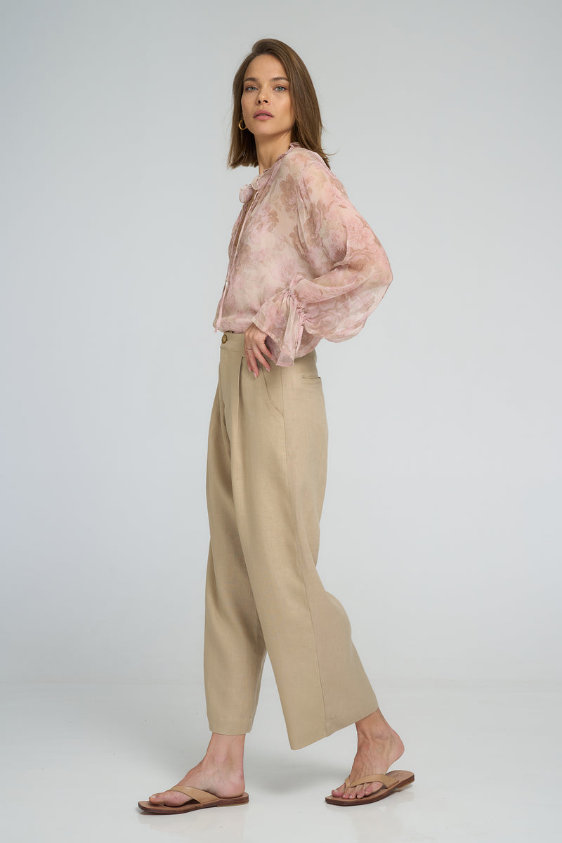 Side view of 7/8 length linen pants with pockets by LILYA