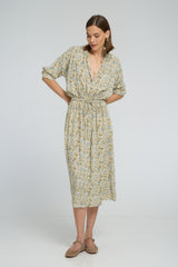 A model wearing a french inspired floral midi dress