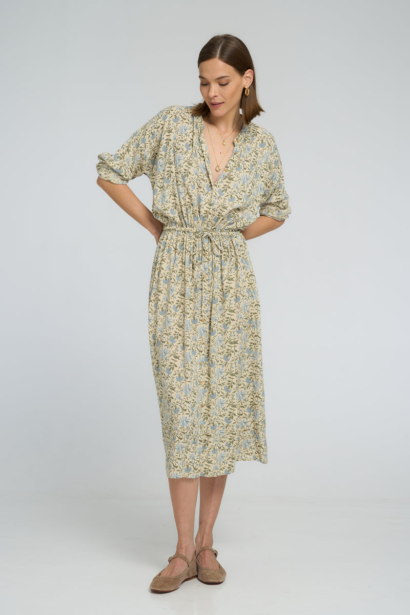 A model wearing a french inspired floral midi dress