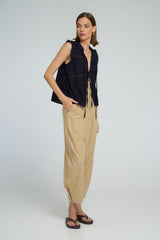 Romantic navy lace top with tie front closures and relaxed sleeveless cut