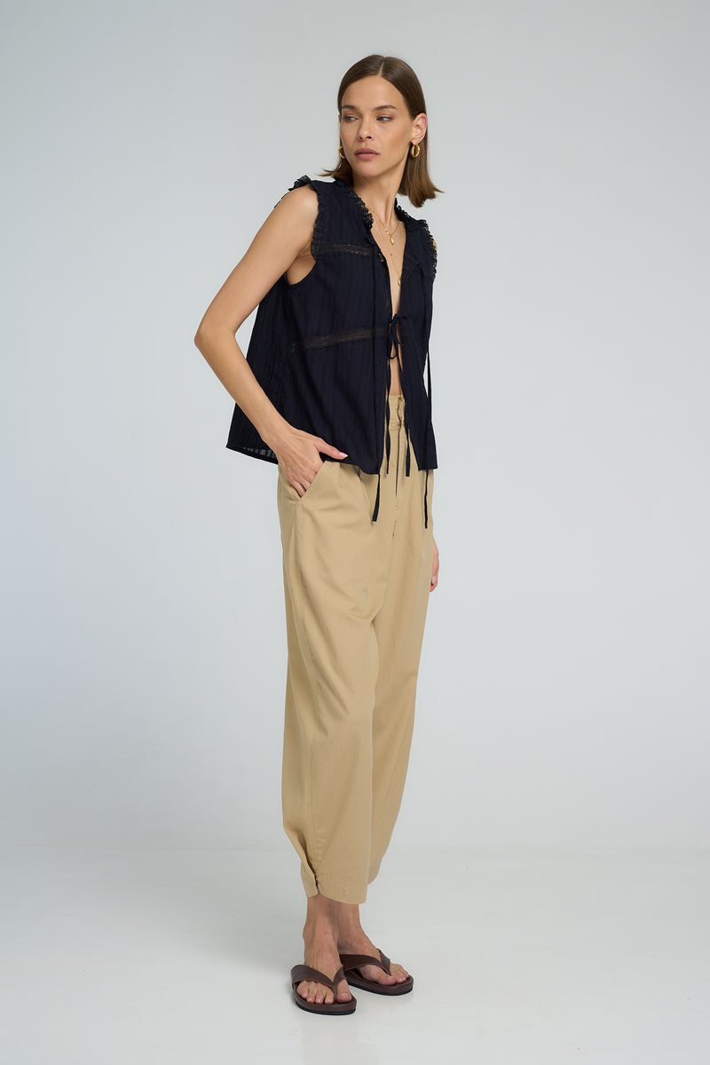 Romantic navy lace top with tie front closures and relaxed sleeveless cut