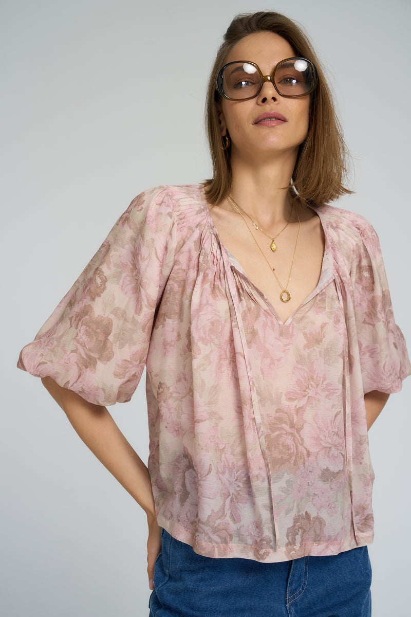 Close-up of pleated details and neck ties on the LILYA Etta blouse