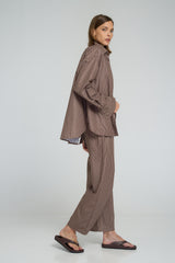 Relaxed fit button-up shirt featuring contrasting panels and a scooped hemline