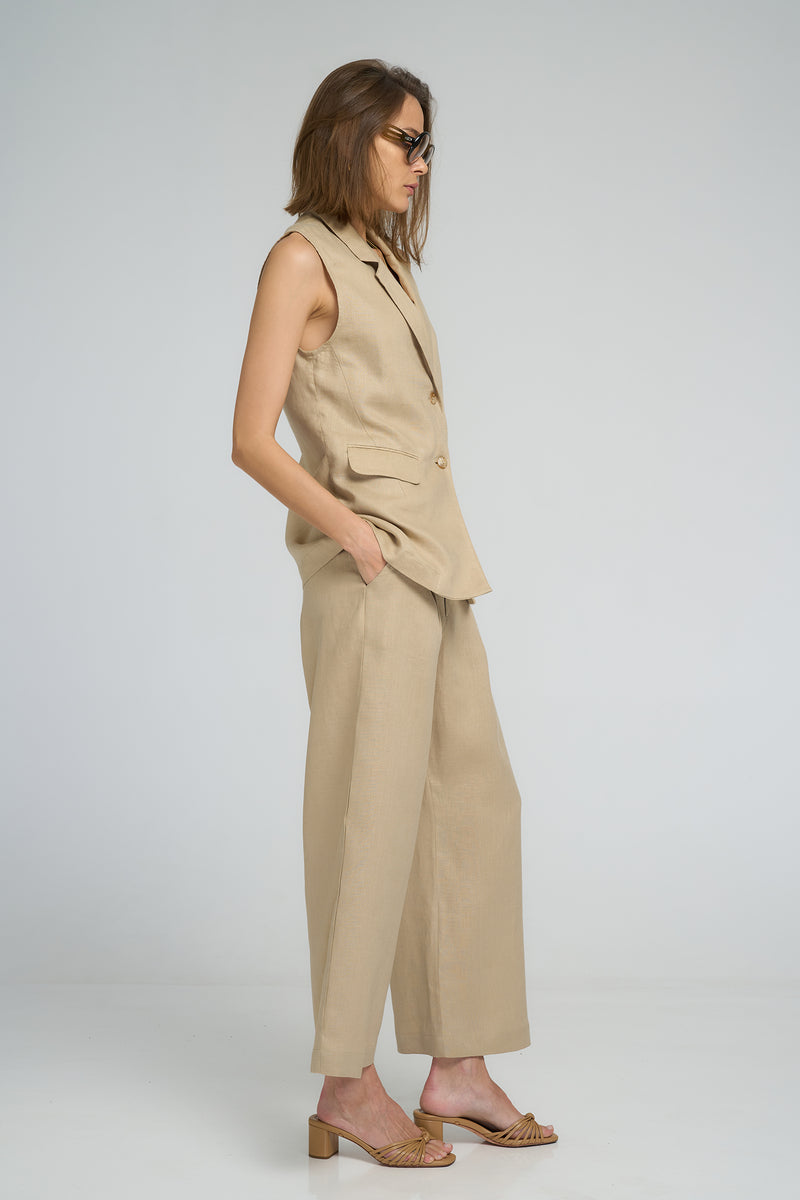 Neutral layering vest by LILYA worn over matching pants