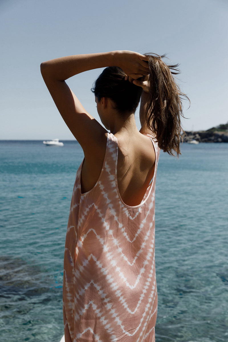Back view highlighting the low scoop back and maxi length