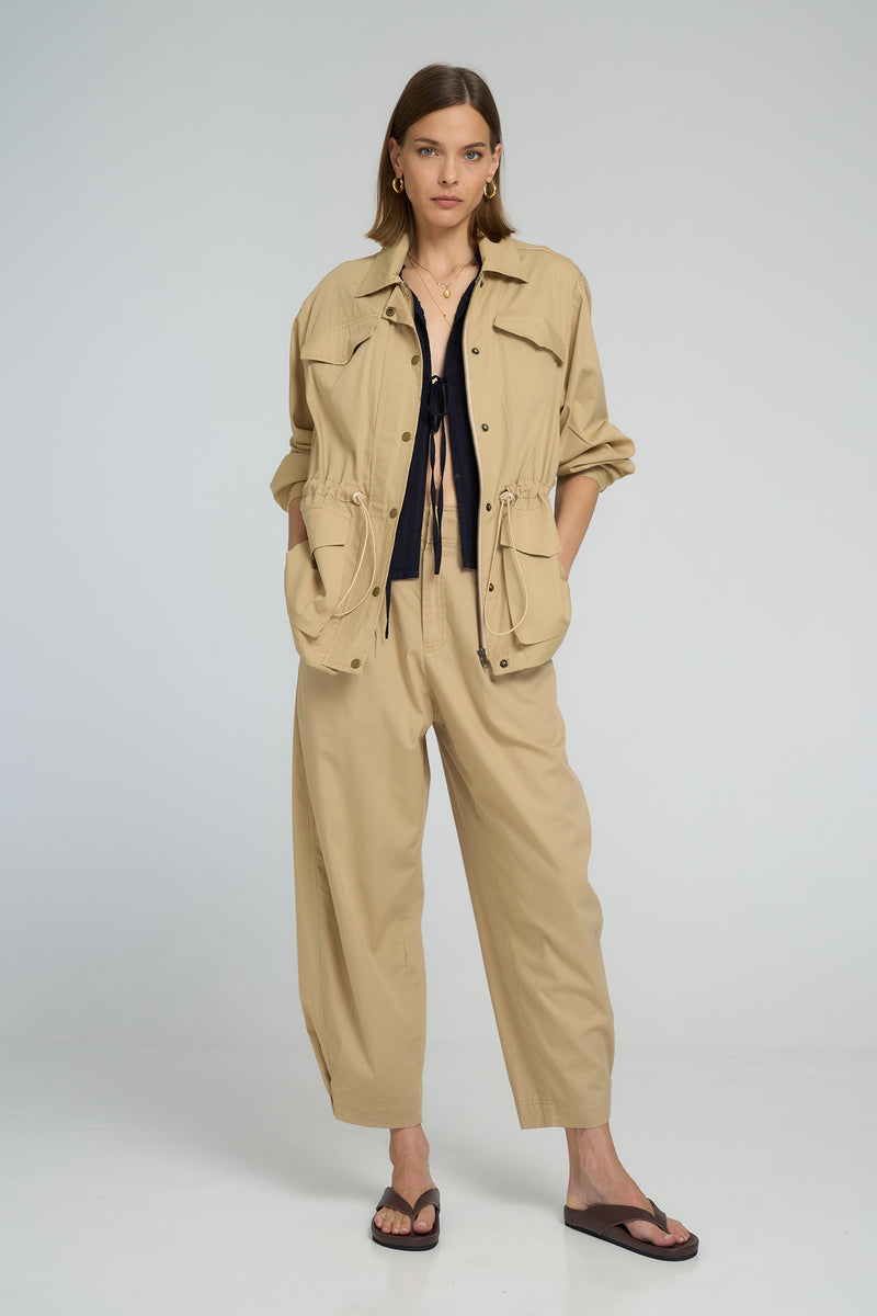 A model wearing a sand casual utility jacket