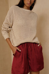 Easy neutral knit top with soft drape and relaxed movement