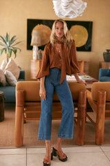 leg cropped jeans styled with blouse