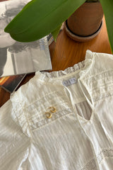 A close up of lace detail on Azalea Top by Lilya
