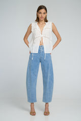Romantic white lace top with tie front closures and relaxed sleeveless cut