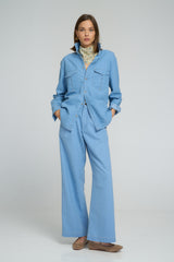 Casual everyday outfit featuring light blue chambray shirt and matching trousers