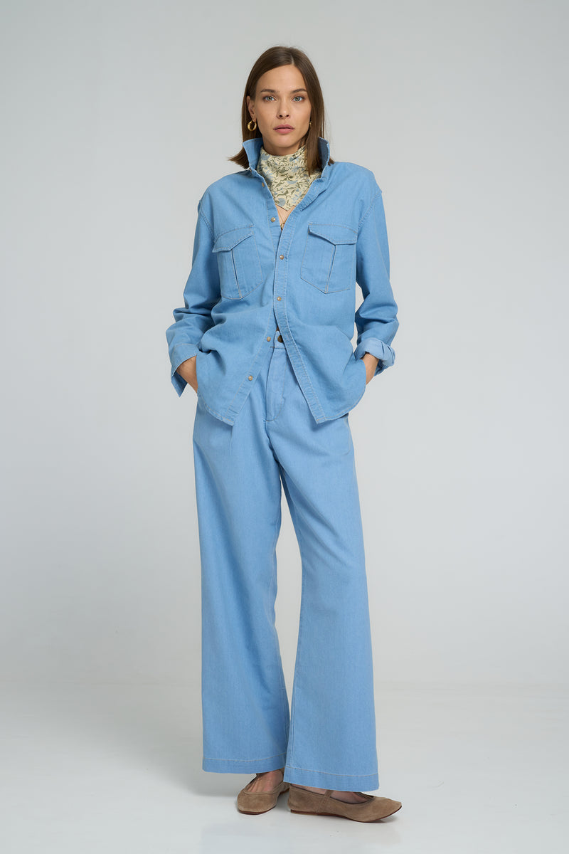 Casual everyday outfit featuring light blue chambray shirt and matching trousers
