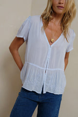 Powder blue embroidered peplum top with flutter sleeves detail
