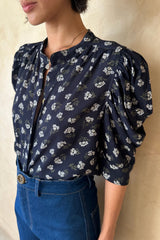 Side view of the Woodford Top in Yarrow Navy with puff sleeves.