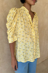 Close-up of the delicate yarrow flower print on the Woodford Top in Yarrow Yellow.