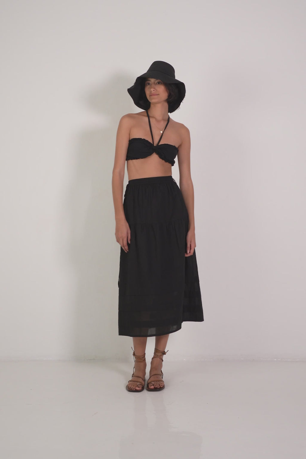 A Woman Wearing a Black Summer Crop Top 